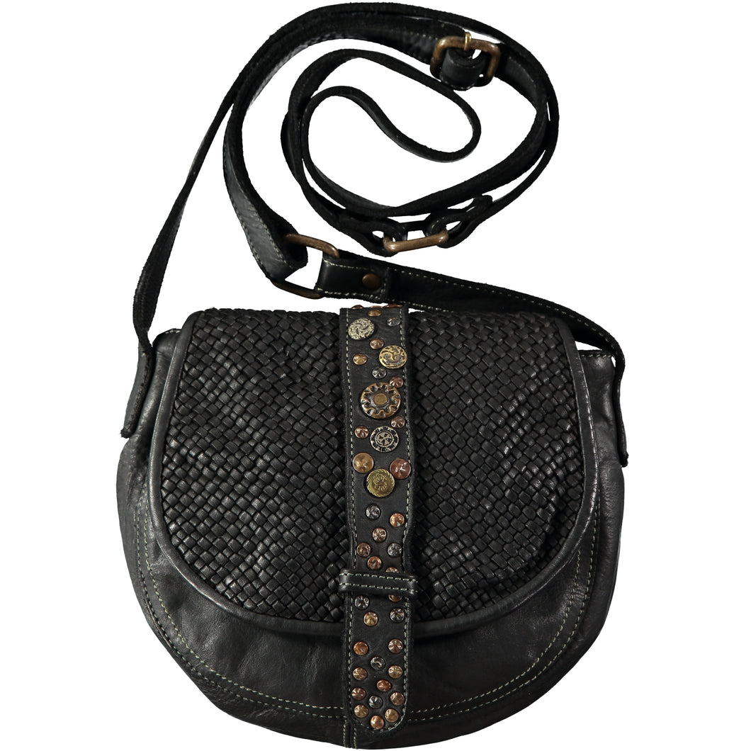 Small black multi-color rivet-stamped oblong crossbody bag with braided leather flap and adjustable crossbody strap. Handmade leather products made in Barcelona, Spain by a family-owned company for over 35 years
